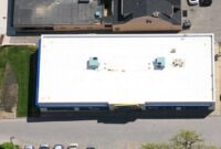 Why Do Large Commercial Buildings Use Flat Roof Designs?